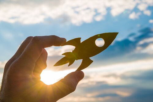 Child holding a toy spaceship